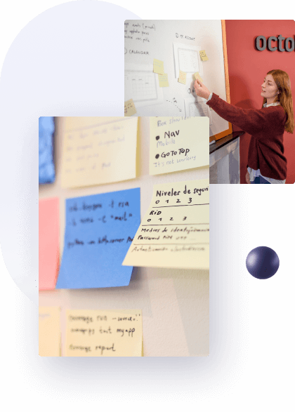 Woman moving a post it in a board of a software design company.