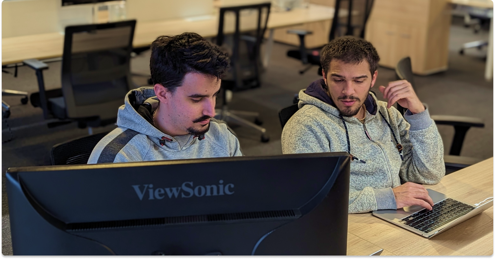 two devs working on their computer